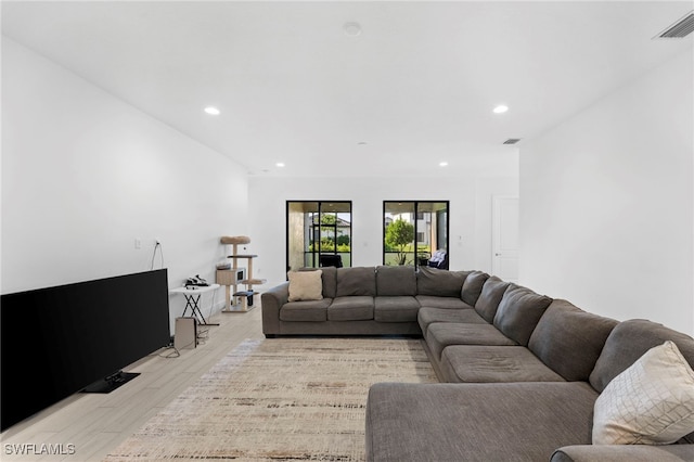 living room with light hardwood / wood-style flooring