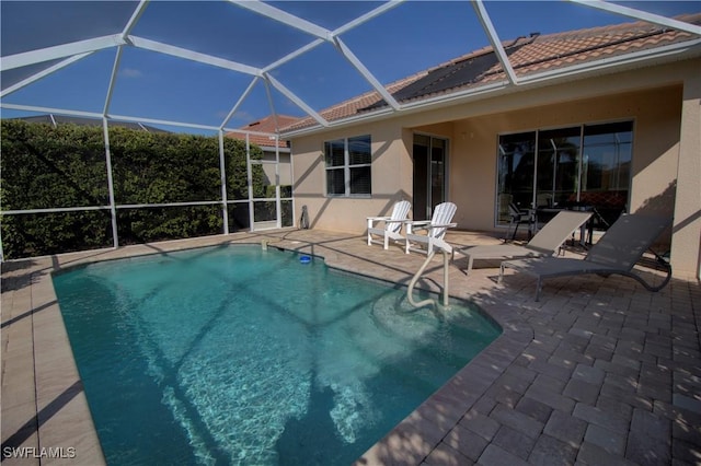 view of pool with a lanai and a patio