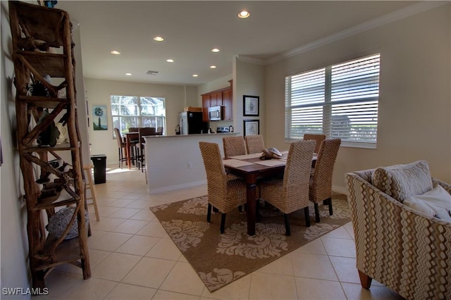 tiled dining room with crown molding