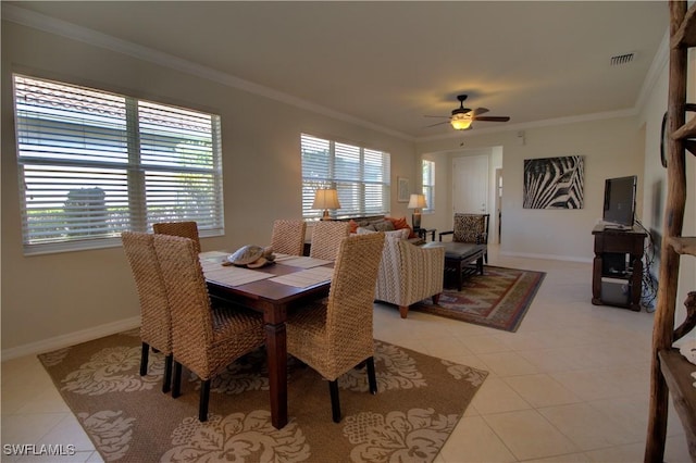 dining room with light tile patterned floors, ceiling fan, and crown molding