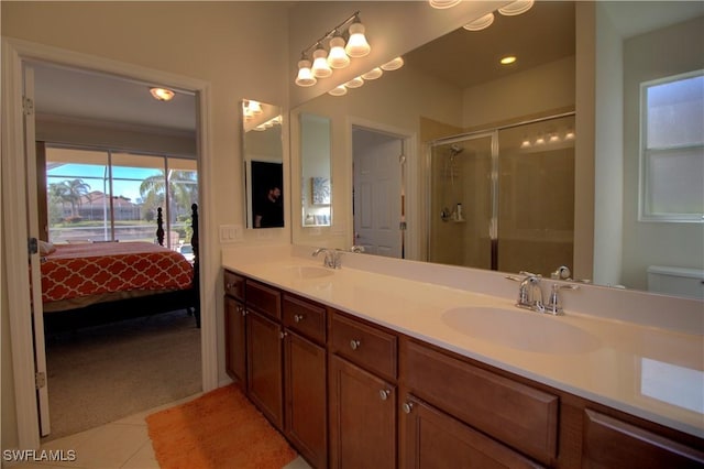 8748 Querce Ct S, Naples, FL 34114 - ensuite bathroom with double vanity, a shower stall, tile patterned floors, and recessed lighting