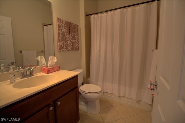 full bathroom featuring tile patterned flooring, vanity, toilet, and shower / bath combo