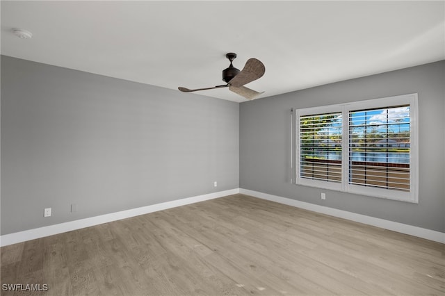 unfurnished room with ceiling fan and light wood-type flooring