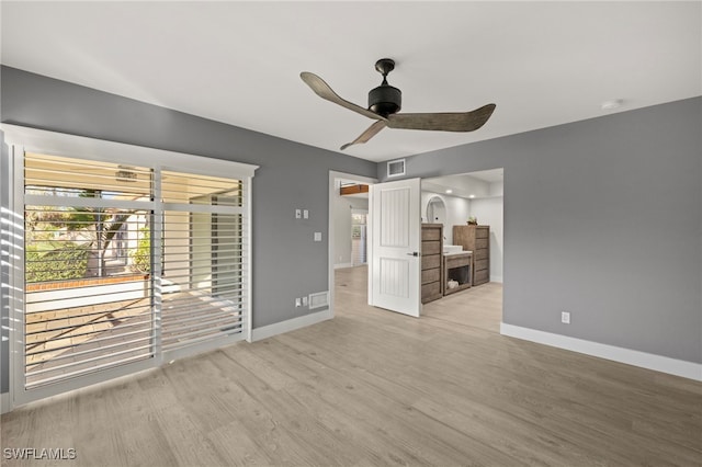 unfurnished living room with light hardwood / wood-style flooring and ceiling fan