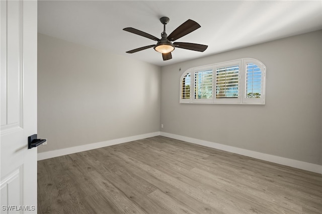 unfurnished room with light wood-type flooring and ceiling fan