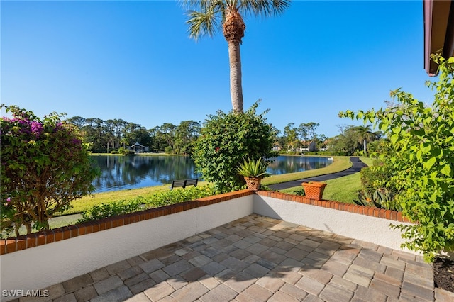 view of patio featuring a water view