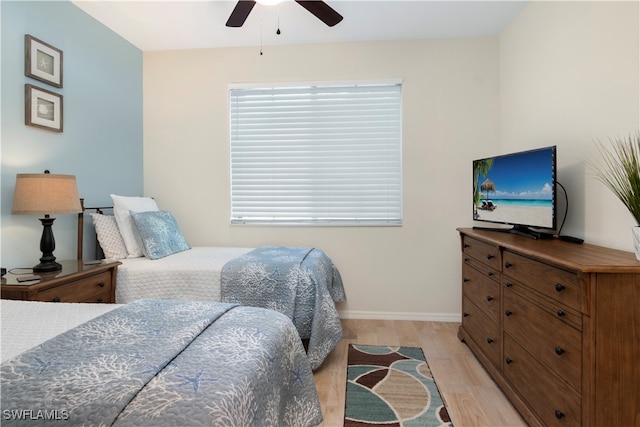 bedroom featuring light hardwood / wood-style floors and ceiling fan