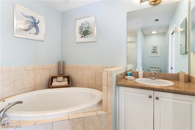 bathroom featuring vanity and independent shower and bath