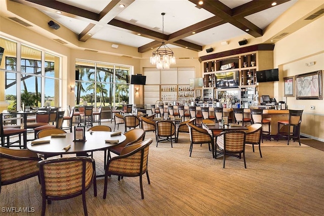 carpeted dining room with beam ceiling, a towering ceiling, coffered ceiling, and a notable chandelier