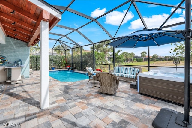 view of swimming pool featuring a lanai, a patio area, and an outdoor hangout area