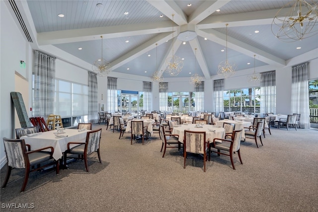 dining room with carpet flooring, a notable chandelier, beam ceiling, and high vaulted ceiling