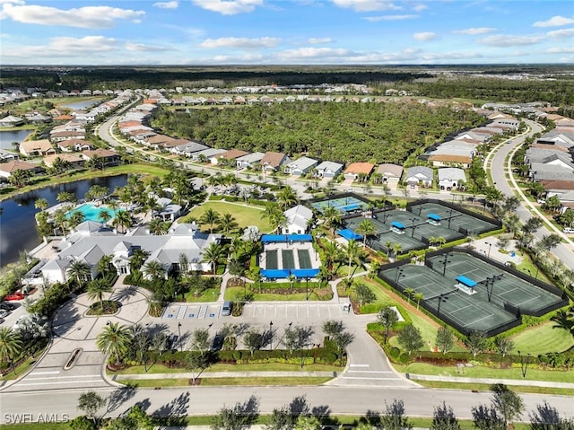 birds eye view of property featuring a water view and a residential view