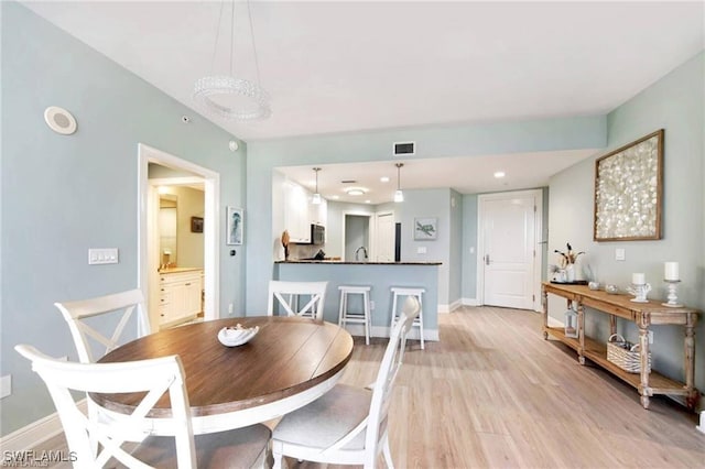 dining area featuring light hardwood / wood-style flooring