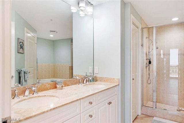 bathroom with vanity, tile patterned floors, and walk in shower