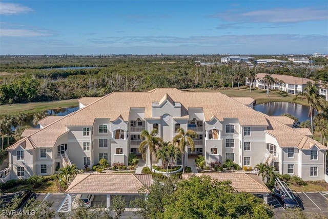 drone / aerial view with a water view