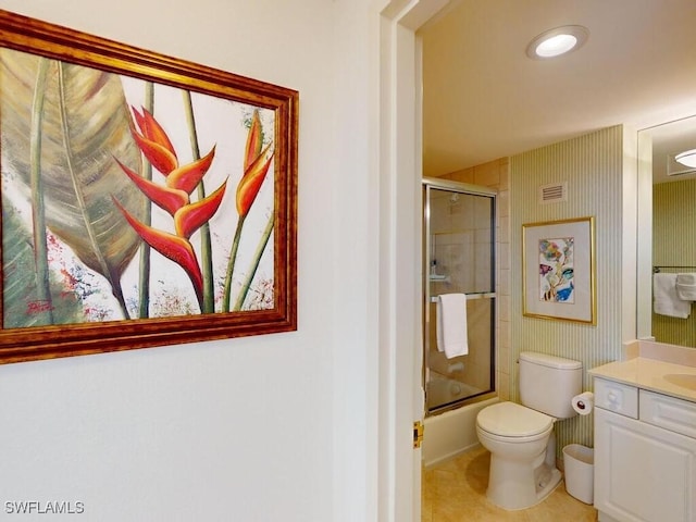 full bathroom with tile patterned flooring, vanity, toilet, and combined bath / shower with glass door