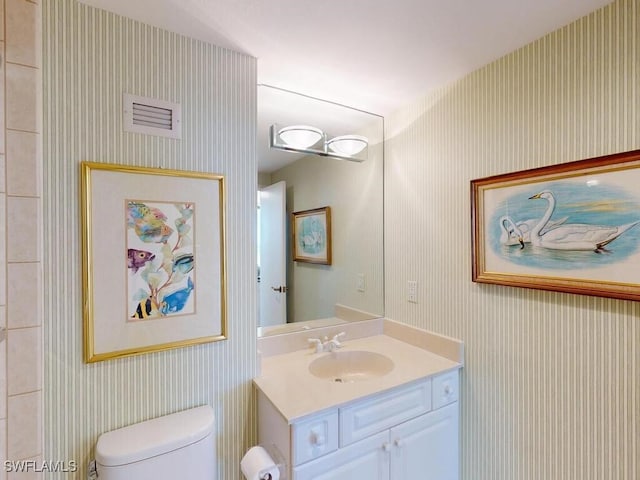 bathroom with vanity and toilet