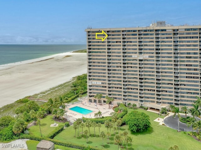 exterior space featuring a water view and a view of the beach