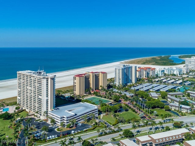 drone / aerial view with a beach view and a water view