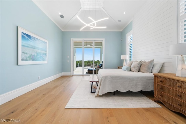 bedroom featuring access to outside, light hardwood / wood-style flooring, and ornamental molding