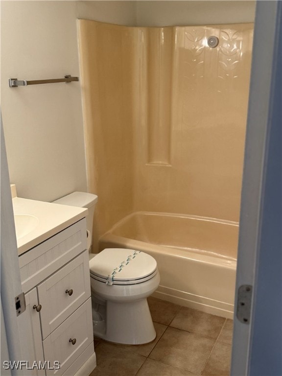 full bathroom featuring tile patterned floors, bathing tub / shower combination, vanity, and toilet