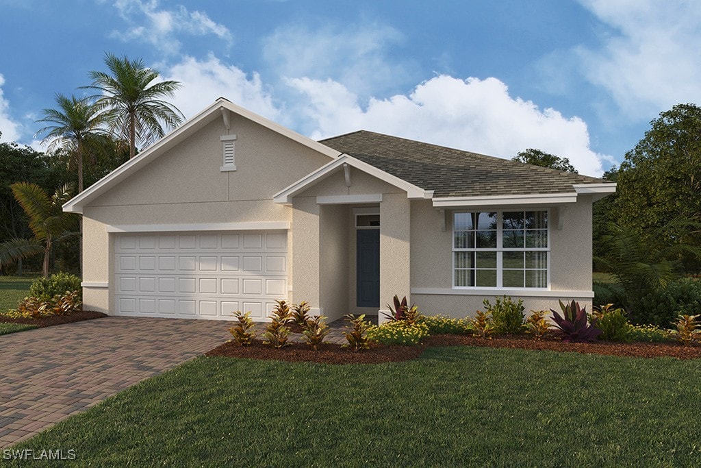 single story home featuring a front yard and a garage