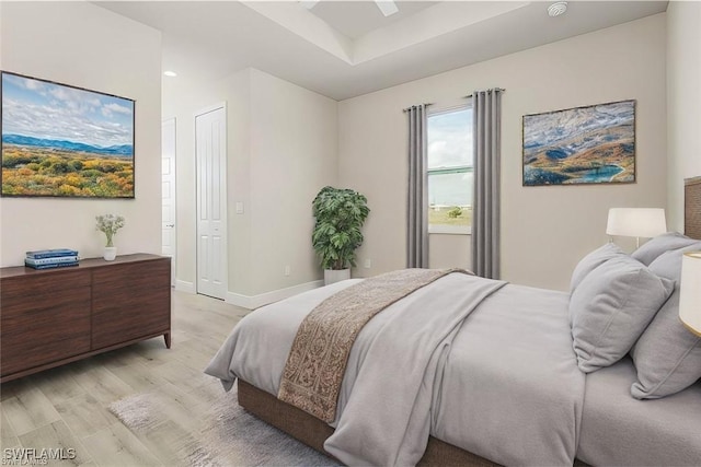 bedroom featuring ceiling fan and light wood-type flooring