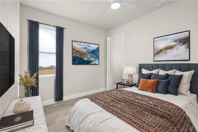 bedroom featuring ceiling fan and light wood-type flooring