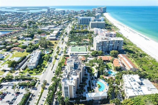 bird's eye view featuring a view of the beach and a water view