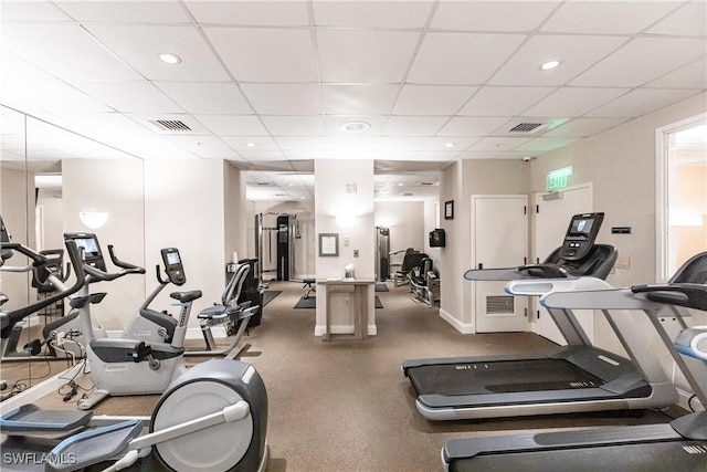 exercise room featuring a drop ceiling