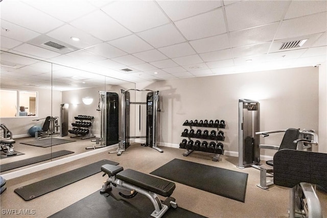 workout area featuring a drop ceiling