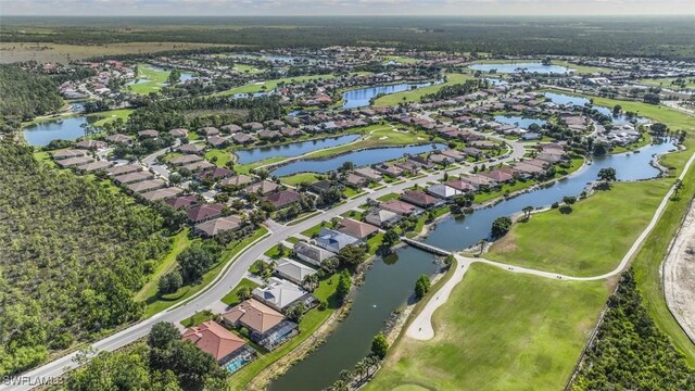 bird's eye view featuring a residential view and a water view