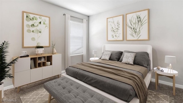 bedroom featuring carpet and baseboards