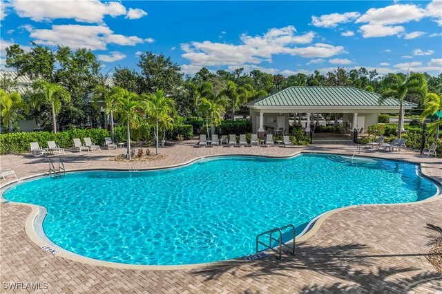 community pool featuring a patio and a gazebo