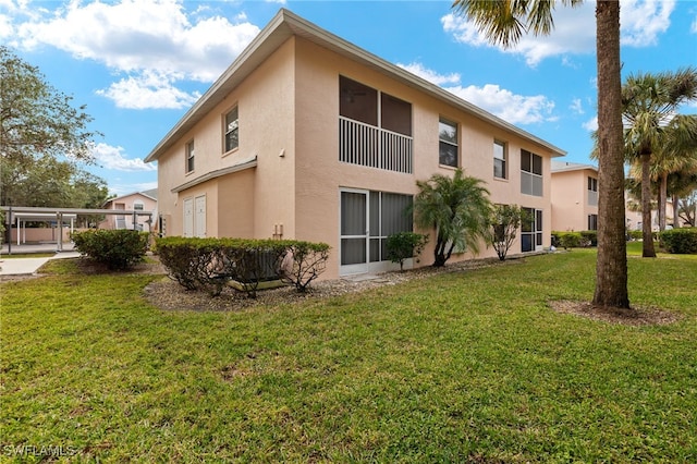 view of side of property with a lawn