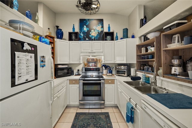 kitchen with white cabinetry, sink, light tile patterned floors, and white appliances