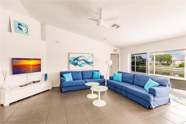 tiled living room with ceiling fan and lofted ceiling