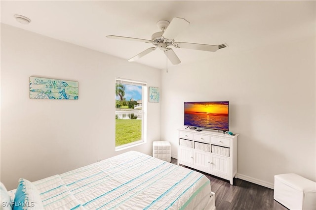 bedroom featuring dark hardwood / wood-style floors and ceiling fan