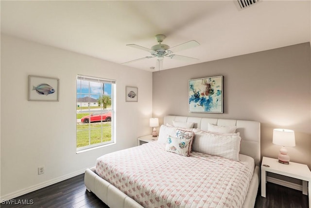 bedroom featuring ceiling fan and dark hardwood / wood-style flooring