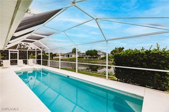 view of swimming pool featuring a patio, a water view, and a lanai