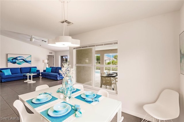 tiled dining room with ceiling fan