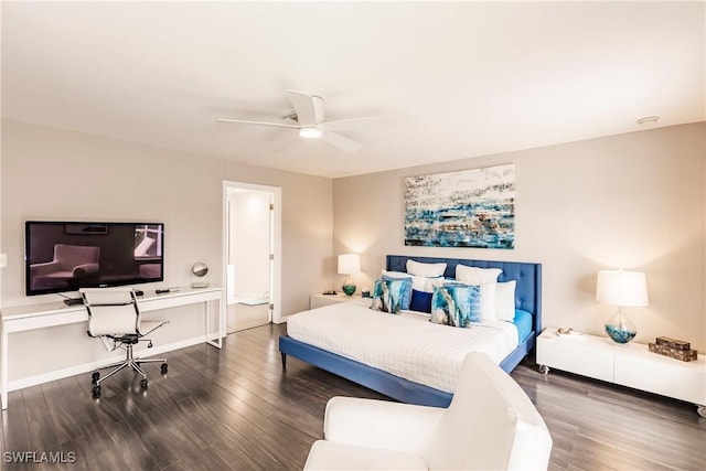 bedroom with dark hardwood / wood-style floors and ceiling fan