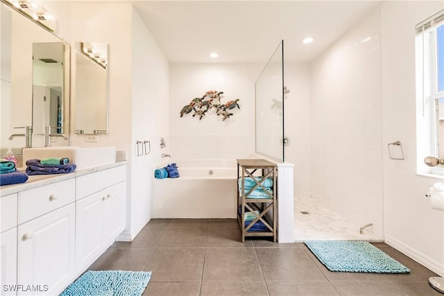 bathroom with tile patterned flooring, vanity, and independent shower and bath