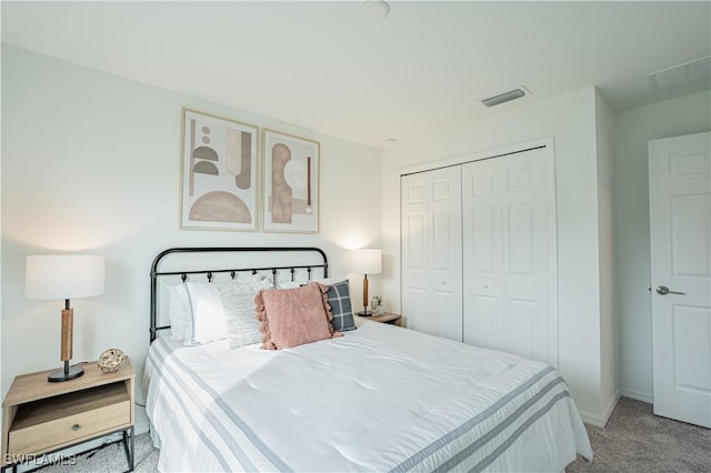 bedroom with light carpet and a closet