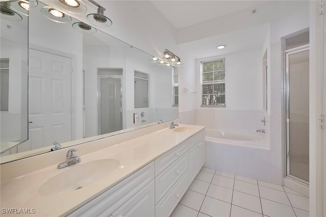 bathroom featuring tile patterned floors, vanity, and independent shower and bath