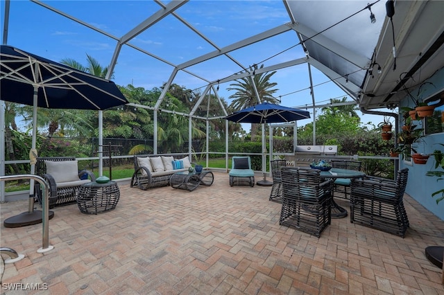 view of patio / terrace with glass enclosure, fence, and an outdoor living space