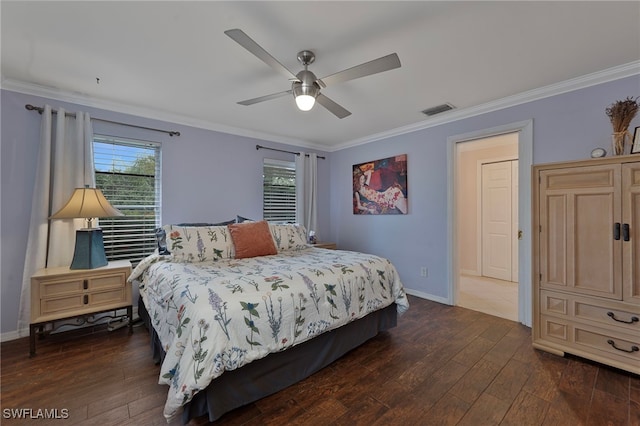 bedroom featuring ornamental molding, dark wood finished floors, and baseboards