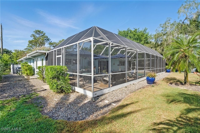 back of property featuring a yard