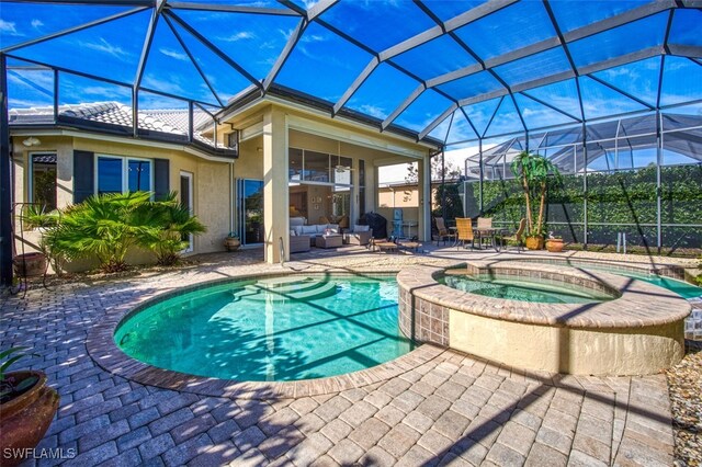 view of swimming pool with an in ground hot tub, an outdoor living space, glass enclosure, and a patio area