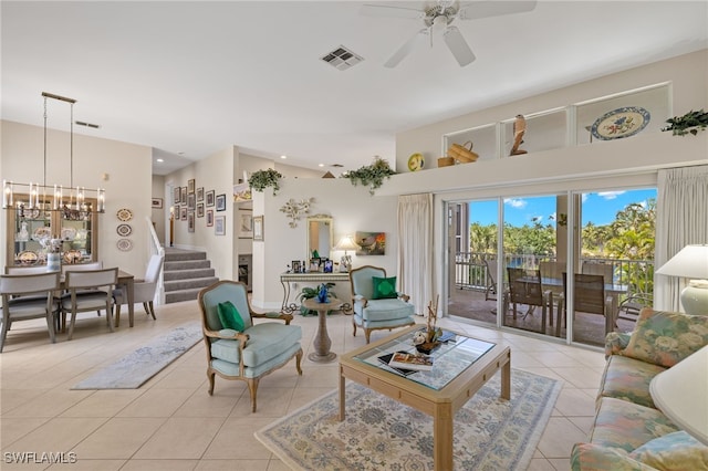 living room with light tile patterned floors and ceiling fan with notable chandelier